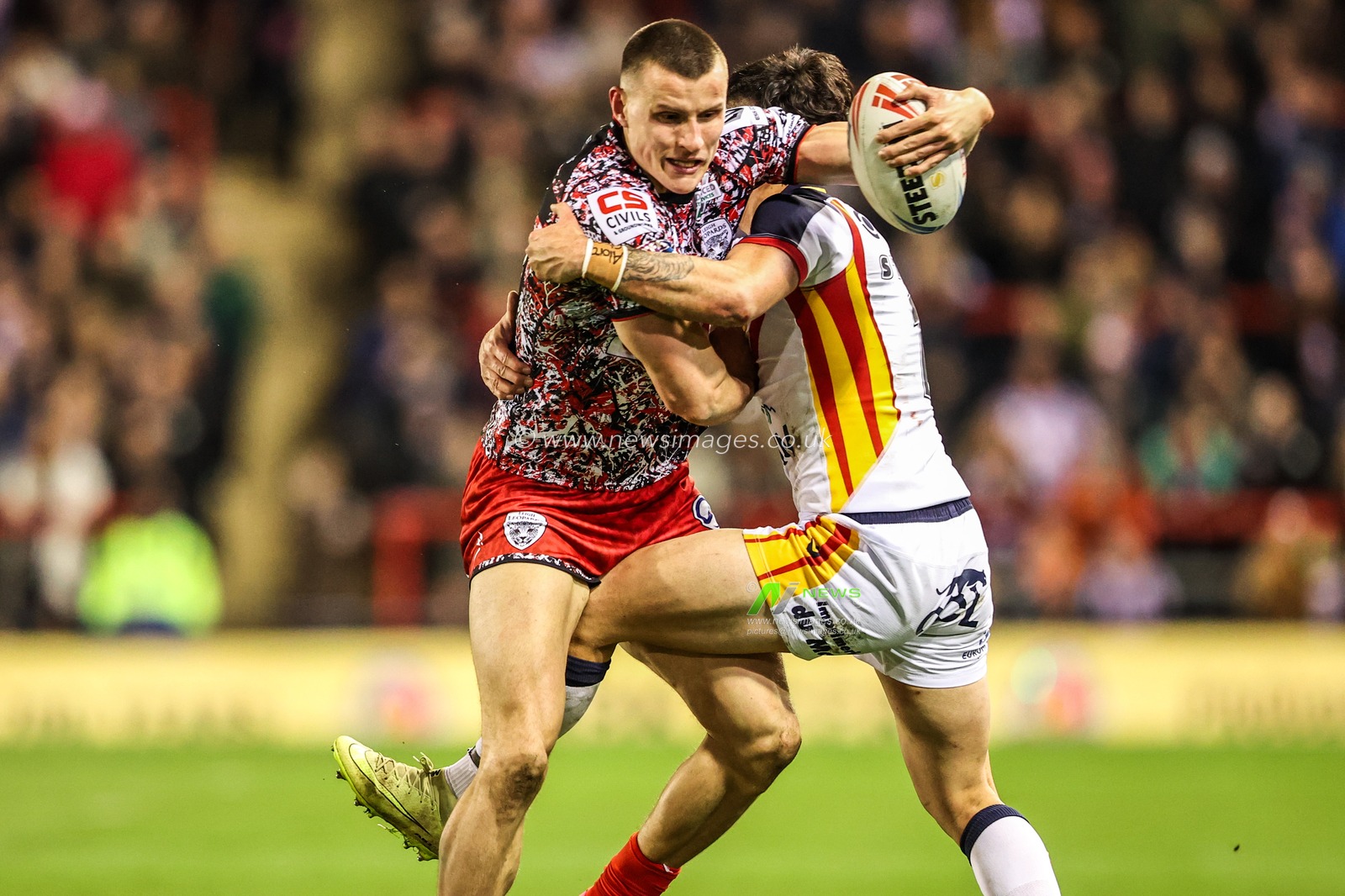 Innes Senior of Leigh Leopards is tackled by Charlie Staines of Catalans Dragons during the Betfred Super League match Leigh Leopards vs Catalans Dragons at Leigh Sports Village, Leigh, United Kingdom on 06 March 2026

(Photo by Alfie Cosgrove/News Images)