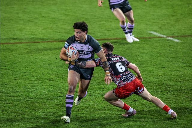 Mathieu Cozza of Huddersfield Giants is tackled by Adam Cook of Leigh Leopards during the Betfred Super League round 9 match Leigh Leopards vs Huddersfield Giants at Leigh Sports Village, Leigh, United Kingdom on 23 April 2026

(Photo by Alfie Cosgrove/News Images)
