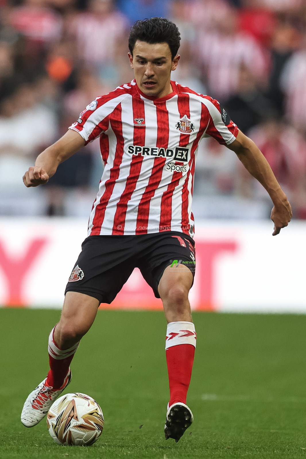 Luke O'Nien of Sunderland passes the ball during the Sky Bet Championship Playoff Semi-final match Sunderland vs Coventry City at Stadium Of Light, Sunderland, United Kingdom, 13th May 2025

(Photo by Alfie Cosgrove/News Images)