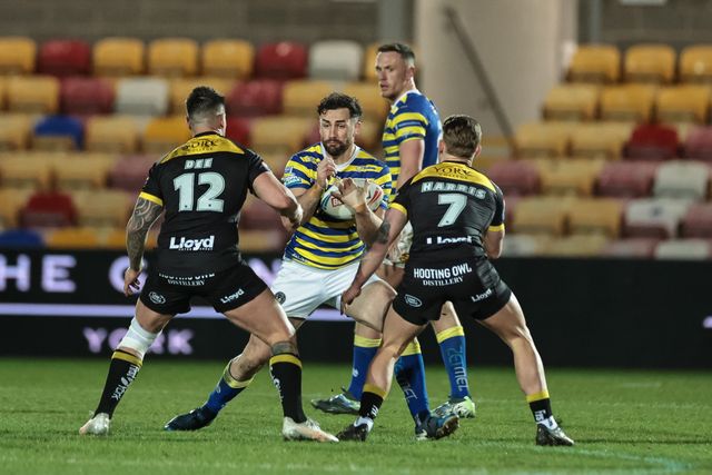 Toby King of Warrington Wolves barges into Jesse Dee of York Knights and Liam Harris of York Knights during the Betfred Super League Round 4 match York Knights vs Warrington Wolves at LNER Community Stadium, York, United Kingdom on 06 March 2026

(Photo by Mark Cosgrove/News Images)