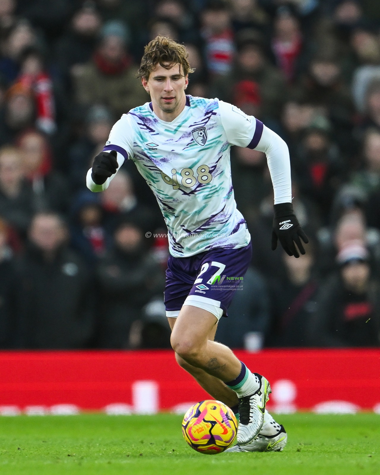 Illya Zabarnyi of Bournemouth makes a break with the ball during the Premier League match Manchester United vs Bournemouth at Old Trafford, Manchester, United Kingdom, 22nd December 2024

(Photo by Craig Thomas/News Images)