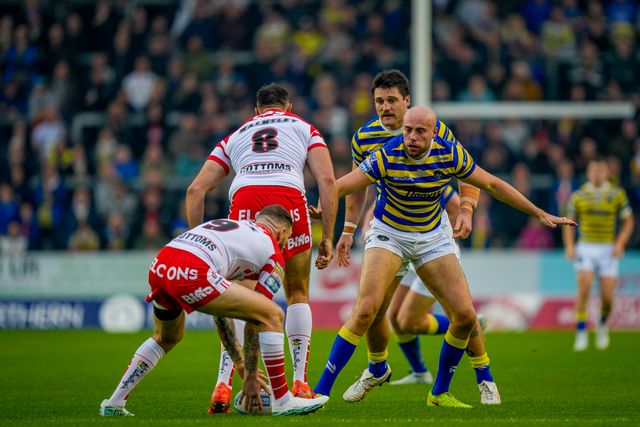 James Harrison of Warrington Wolves blocks the run of Alex Walmsley of St Helens R.F.C. and Daryl Clark of St Helens R.F.C. during the Betfred Super League round 14 match St Helens vs Warrington Wolves at The BrewDog Stadium, St Helens, United Kingdom on 11 June 2026

(Photo by Maynard Manyowa/News Images)