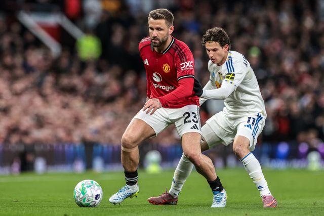 Luke Shaw of Manchester United holds off Brenden Aaronson of Leeds United during the Premier League match Manchester United vs Leeds United at Old Trafford, Manchester, United Kingdom on 13 April 2026

(Photo by Mark Cosgrove/News Images)