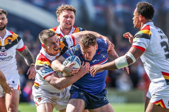 Jake Trueman of Wakefield Trinity is tackled by Loghan Lewis of Bradford Bulls and Leon Ruan of Bradford Bulls during the Betfred Super League round 8 match Wakefield Trinity vs Bradford Bulls at DIY Kitchens Stadium, Wakefield, United Kingdom on 18 April 2026

(Photo by Alfie Cosgrove/News Images)