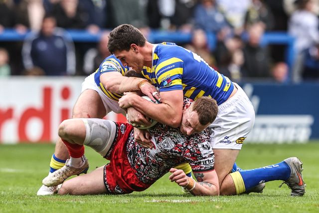 Frankie Halton of Leigh Leopards is tackled by Sam Stone of Warrington Wolves during the Betfred Super League round 7 match Warrington Wolves vs Leigh Leopards at The Halliwell Jones Stadium, Warrington, United Kingdom on 04 April 2026

(Photo by Alfie Cosgrove/News Images)