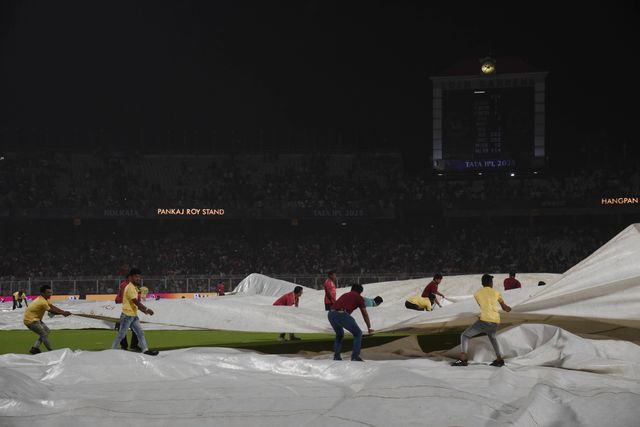 The ground staff work to keep the pitch dry as play is tries to stop the ball due to rain during the 2025 IPL match between Kolkata Knight Riders and Punjab Kings at Eden Gardens on April 26, 2025, in Kolkata, India. Photo by Debajyoti Chakraborty.(Photo: Debajyoti Chakraborty/News Images)