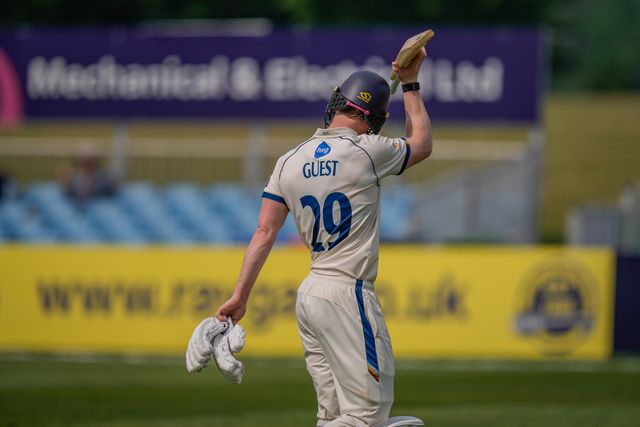 Brooke Guest raises his bat to salute the crowd after scoring a hundred and being dismissed during the County Championship Division Two Derbyshire vs Northamptonshire day one match at The Central Co-Op County Ground, Derby, United Kingdom on 09 May 2026

(Photo by Maynard Manyowa/News Images)
