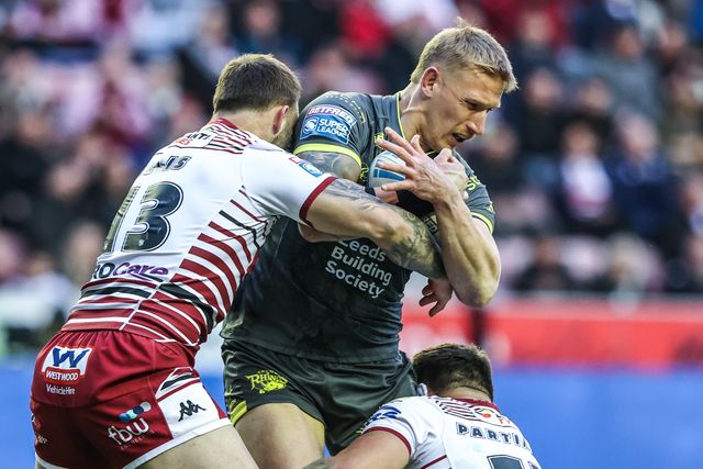 Mikołaj Olędzki of Leeds Rhinos is tackled by Kaide Ellis of Wigan Warriors during the Betfred Super League round 11 match Wigan Warriors vs Leeds Rhinos at The Brick Community Stadium, Wigan, United Kingdom on 15 May 2026

(Photo by Alfie Cosgrove/News Images)