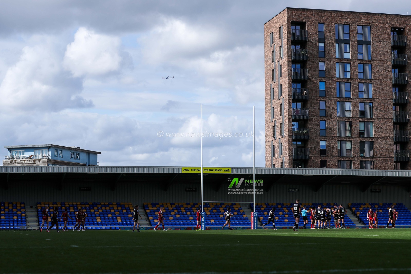 A plane flies over the Cherry Red Records Stadium during the Betfred Super League Round 23 match London Broncos vs Leigh Leopards at Plough Lane, Wimbledon, United Kingdom, 25th August 2024

(Photo by Izzy Poles/News Images)