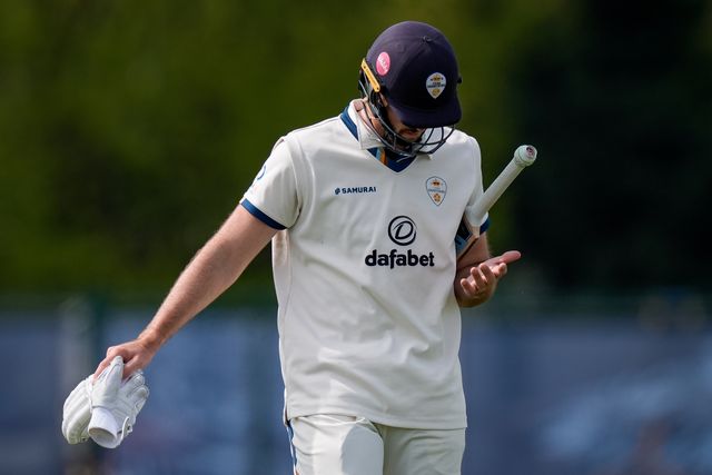 Ben Aitchison walks off after being caught by Cameron Bancroft off the bowling of Craig Miles as Gloucestershire players celebrate a wicket during the County Championship Division Two Derbyshire v Gloucestershire at The Central Co-Op County Ground, Derby, United Kingdom on 26 April 2026

(Photo by Maynard Manyowa/News Images)