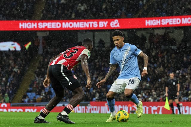 Savinho of Manchester City holds the ball pressured by Michael Kayode of Brentford during the Carabao Cup Quarter Final match Manchester City vs Brentford at Etihad Stadium, Manchester, United Kingdom, 17th December 2025

(Photo by Mark Cosgrove/News Images)

*** GER AUT SUI OUT ***