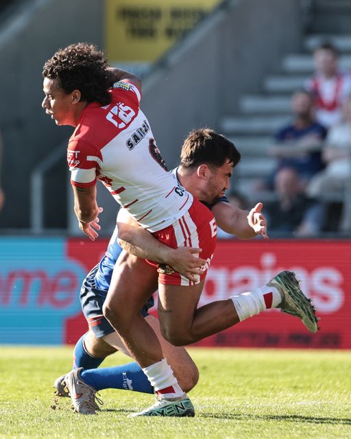 Tristan Sailor of St Helens R.F.C. is tackled by Jack Sinfield of Wakefield Trinity during the Betfred Super League round 9 match St Helens vs Wakefield Trinity at The BrewDog Stadium, St Helens, United Kingdom on 25 April 2026

(Photo by Mark Cosgrove/News Images)