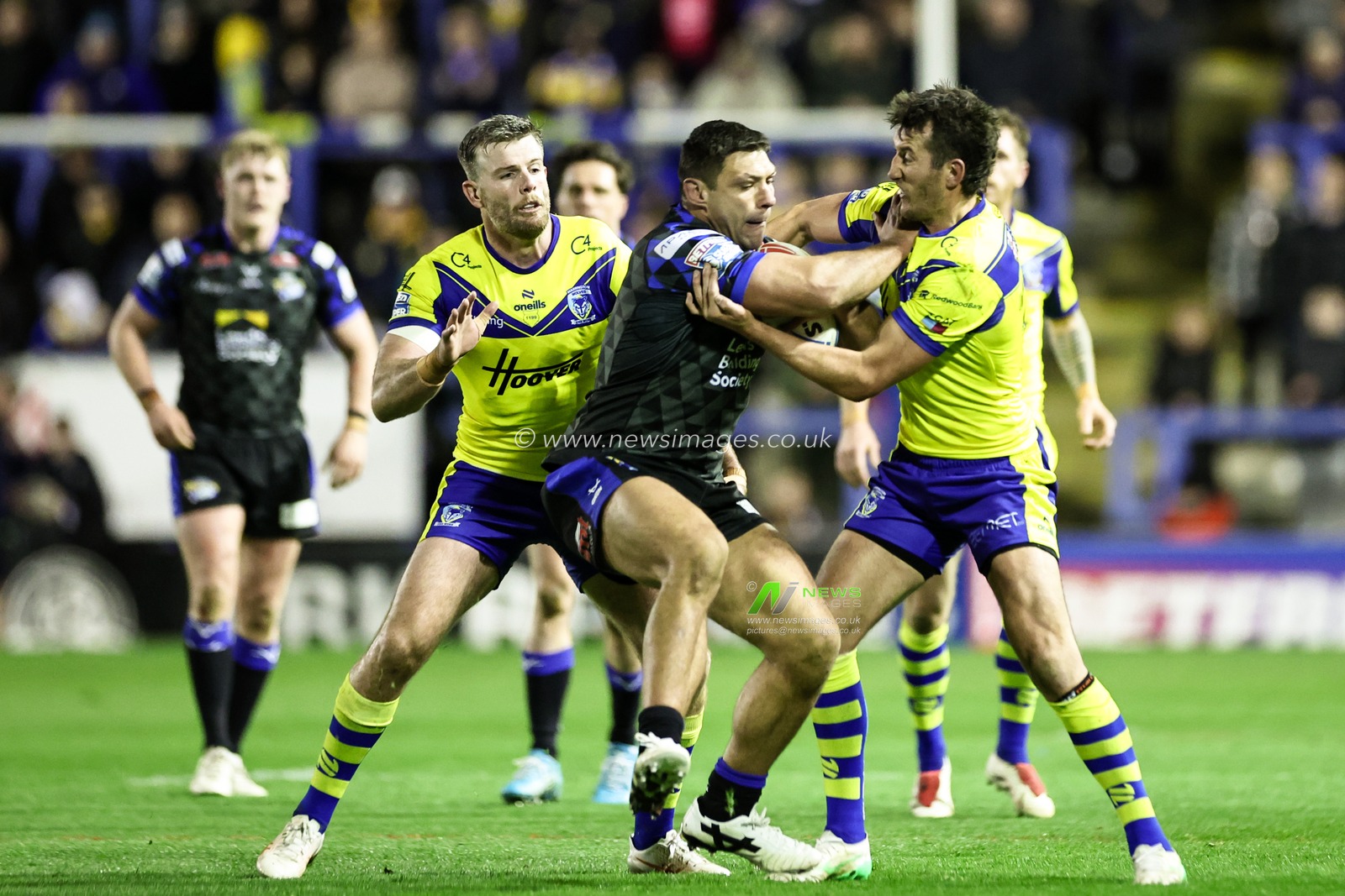 Ryan Hall of Leeds Rhinos is tackled by Stefan Ratchford of Warrington Wolves during the Betfred Super League Round 6 match Warrington Wolves vs Leeds Rhinos at Halliwell Jones Stadium, Warrington, United Kingdom, 28th March 2025

(Photo by Mark Cosgrove/News Images)
