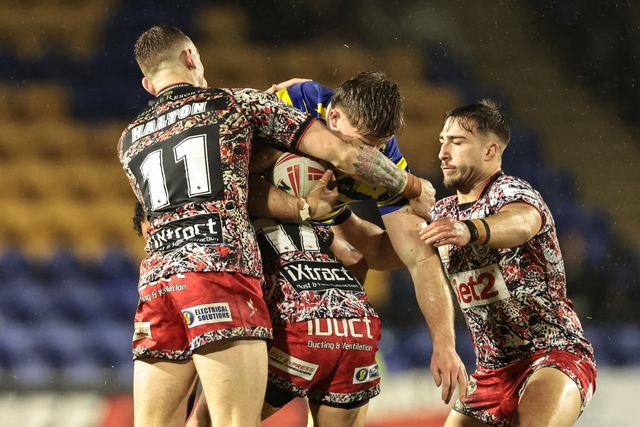 Luke Thomas of Warrington Wolves is tackled by Liam Horne of Leigh Leopards during the Pre Season match Warrington Wolves vs Leigh Leopards at Halliwell Jones Stadium, Warrington, United Kingdom, 30th January 2026

(Photo by Mark Cosgrove/News Images)