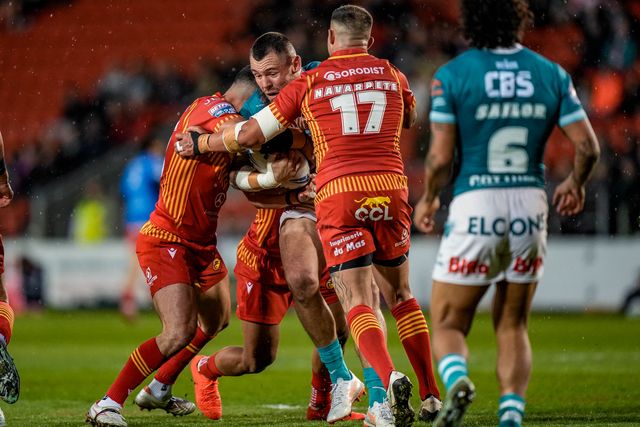 George Whitby of St Helens is tackled by Romain Navarette of Catalans Dragons during the Betfred Challenge Cup Quarter Final match St Helens vs Catalans Dragons at The BrewDog Stadium, St Helens, United Kingdom on 10 April 2026

(Photo by Maynard Manyowa/News Images)