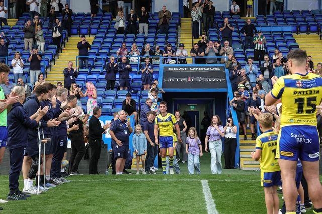 Stefan Ratchford of Warrington Wolves walks out for one last time as players and staff form a guard of honour on his last ever home game as he announces his retirement during the Betfred Super League Round 25 match Warrington Wolves vs Leigh Leopards at Halliwell Jones Stadium, Warrington, United Kingdom, 6th September 2025

(Photo by Mark Cosgrove/News Images)
