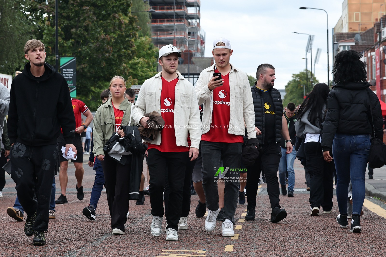 Manchester United fans make their way to the game during the Premier League match Manchester United vs Burnley at Old Trafford, Manchester, United Kingdom, 30th August 2025

(Photo by Mark Cosgrove/News Images)