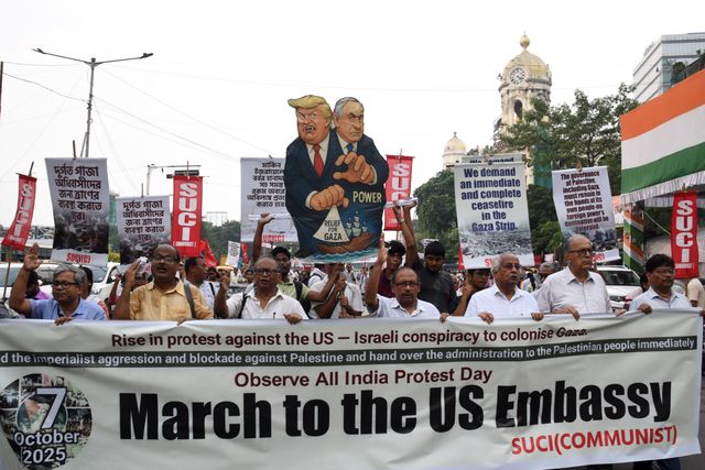 Activists of Social Unity Center of India (SUCI) hold placards and an effigy of US President Donald Trump and Israel's Prime Minister Benjamin Netanyahu during a protest against Western policy in the Israel-Hamas conflict, near US Embassy in Kolkata, Eastern India, 07 October 2025.Photo by Debajyoti Chakraborty.(Photo: Debajyoti Chakraborty/News Images)