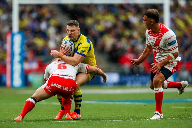 George Williams of Warrington Wolves is tackled during the Betfred Challenge Cup Final Warrington Wolves vs Hull KR at Wembley Stadium, London, United Kingdom, 7th June 2025

(Photo by Izzy Poles/News Images)