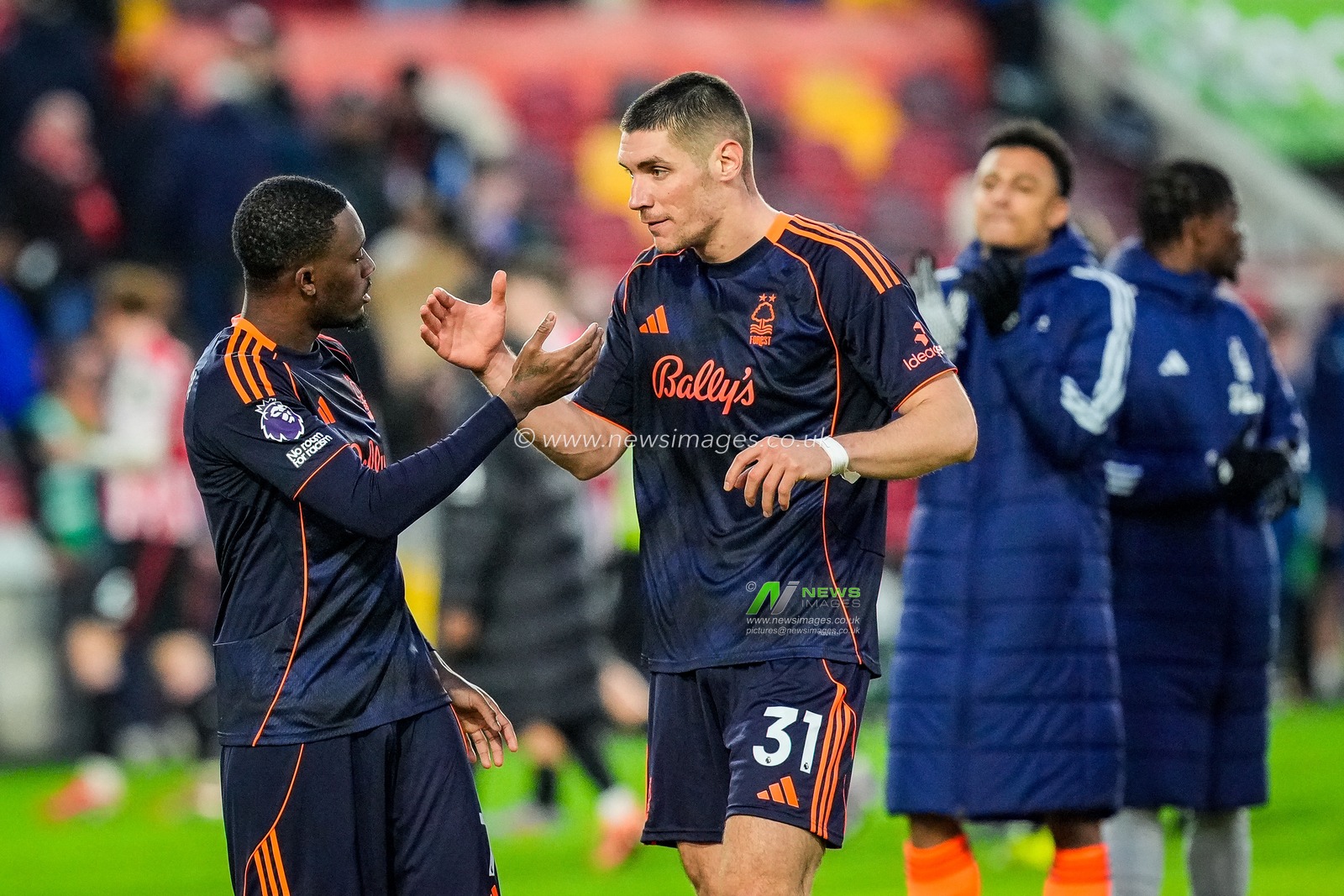 Nikola Milenkovic of Nottingham Forest and Callum Hudson-Odoi of Nottingham Forest shake hands and applauds the fans after the final whistle  during the Premier League match Brentford vs Nottingham Forest at The Gtech Community Stadium, London, United Kingdom, 25th January 2026

(Photo by Maynard Manyowa/News Images)