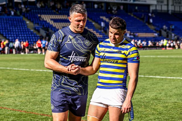 Sam Burgess manager of Warrington shakes hands with Josh Smith of Warrington Wolves as he is named player of the match during the Betfred Super League round 12 match Warrington Wolves vs Bradford Bulls at The Halliwell Jones Stadium, Warrington, United Kingdom on 24 May 2026

(Photo by Alfie Cosgrove/News Images)