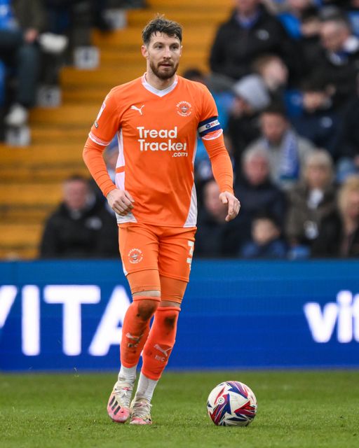 James Husband of Blackpool makes a break with the ball during the Sky Bet League 1 match Stockport County vs Blackpool at Edgeley Park Stadium, Stockport, United Kingdom, 1st March 2025

(Photo by Craig Thomas/News Images)