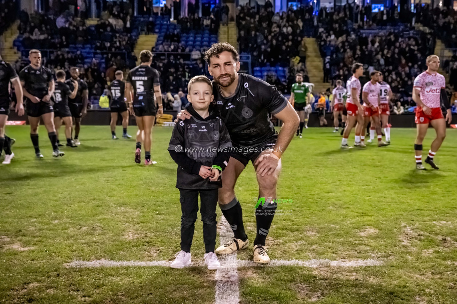 Toby King of Warrington Wolves with his nephew ahead of  the Toby King's Testimonial match Warrington Wolves vs Leigh Leopards at Halliwell Jones Stadium, Warrington, United Kingdom, 1st February 2025

(Photo by Craig Thomas/News Images)