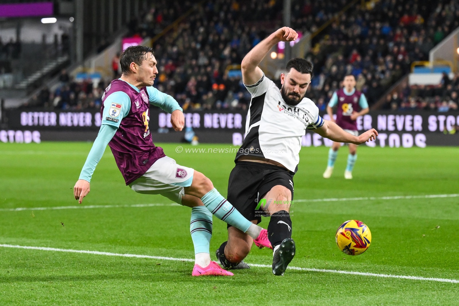 Connor Roberts of Burnley is tackled by Eiran Cashin of Derby County during the Sky Bet Championship match Burnley vs Derby County at Turf Moor, Burnley, United Kingdom, 10th December 2024

(Photo by Craig Thomas/News Images)