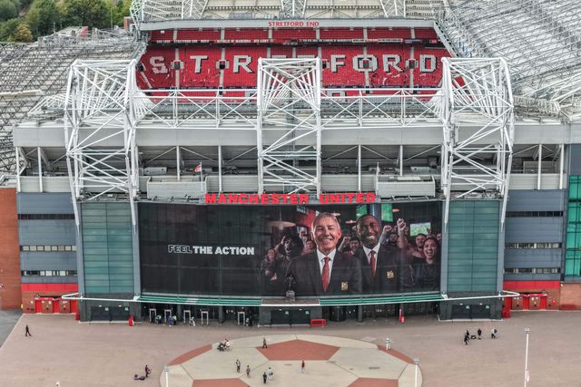 Former Manchester United players Bryan Robson and Andy Cole on the mural above the club store during the UEFA Champions League Matchday 1 of 8 match Manchester United vs Sabah FK at Old Trafford, Manchester, United Kingdom on 10 September 2026

(Photo by Mark Cosgrove/News Images)