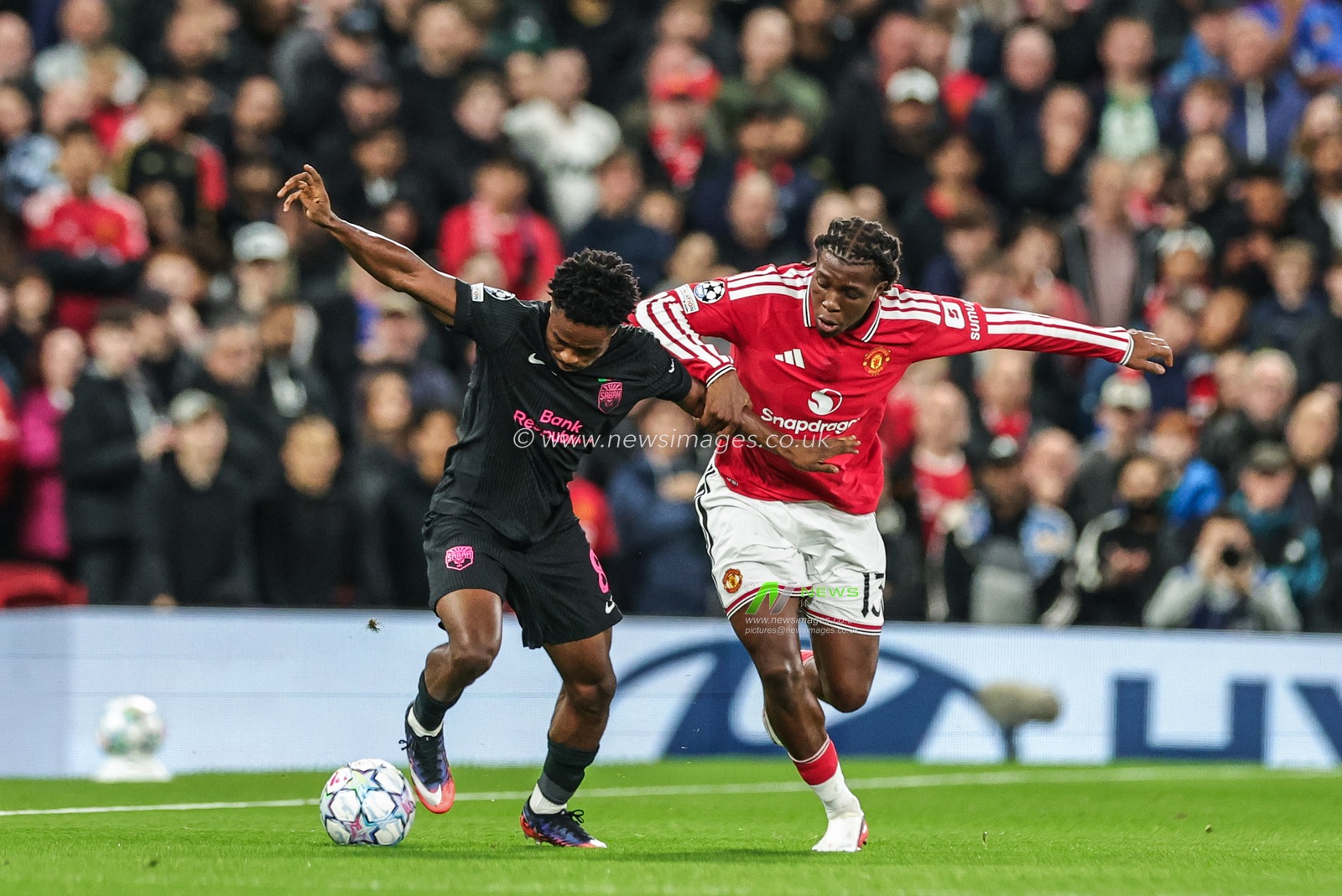Christian Nwachukwu of Sabah FK and Patrick Dorgu of Manchester United battle for the ball during the UEFA Champions League Matchday 1 of 8 match Manchester United vs Sabah FK at Old Trafford, Manchester, United Kingdom on 10 September 2026

(Photo by Mark Cosgrove/News Images)