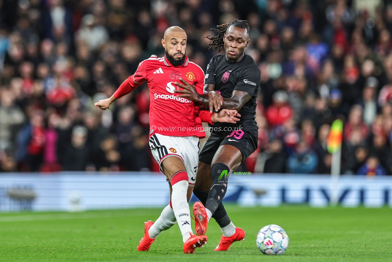 Noussair Mazraoui of Manchester United passes the ball under pressure from Orphé Mbina of Sabah FK during the UEFA Champions League Matchday 1 of 8 match Manchester United vs Sabah FK at Old Trafford, Manchester, United Kingdom on 10 September 2026

(Photo by Mark Cosgrove/News Images)