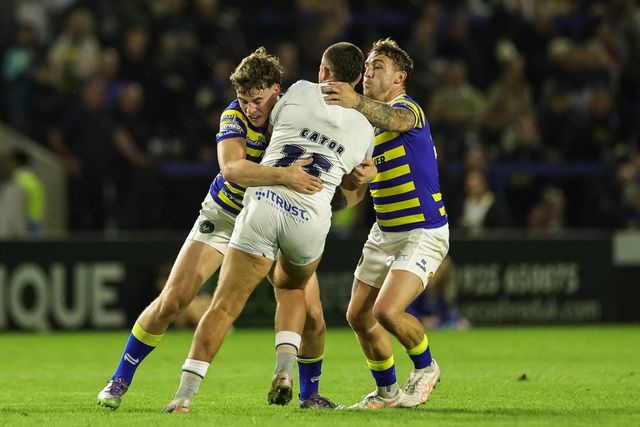 Joe Cator of Toulouse Olympique is tackled by Ewan Smith of Warrington Wolves and Sam Powell of Warrington Wolves during the Betfred Super League round 27 match Warrington Wolves vs Toulouse Olympique at The Halliwell Jones Stadium, Warrington, United Kingdom on 11 September 2026

(Photo by Mark Cosgrove/News Images)