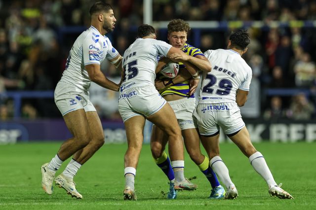 Cai Taylor-Wray of Warrington Wolves is tackled by Joe Cator of Toulouse Olympique and César Rougé of Toulouse Olympique during the Betfred Super League round 27 match Warrington Wolves vs Toulouse Olympique at The Halliwell Jones Stadium, Warrington, United Kingdom on 11 September 2026

(Photo by Mark Cosgrove/News Images)