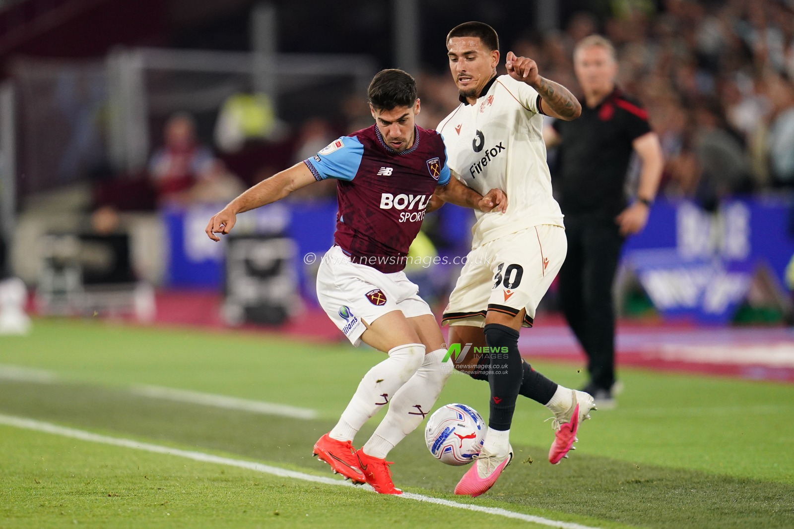 Manor Solomon of West Ham United and Danny Imray of Wrexham battle during the Sky Bet Championship match West Ham United vs Wrexham at London Stadium, London, United Kingdom on 11 September 2026

(Photo by Harvey Murphy/News Images)
