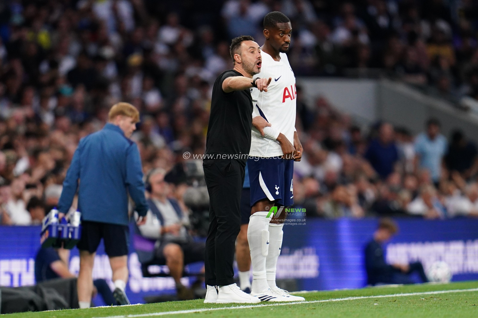 Roberto De Zerbi manager of Tottenham Hotspur and Tosin Adarabioyo of Tottenham Hotspur during the Premier League match Tottenham Hotspur vs Everton at Tottenham Hotspur Stadium, London, United Kingdom on 12 September 2026

(Photo by Harvey Murphy/News Images)