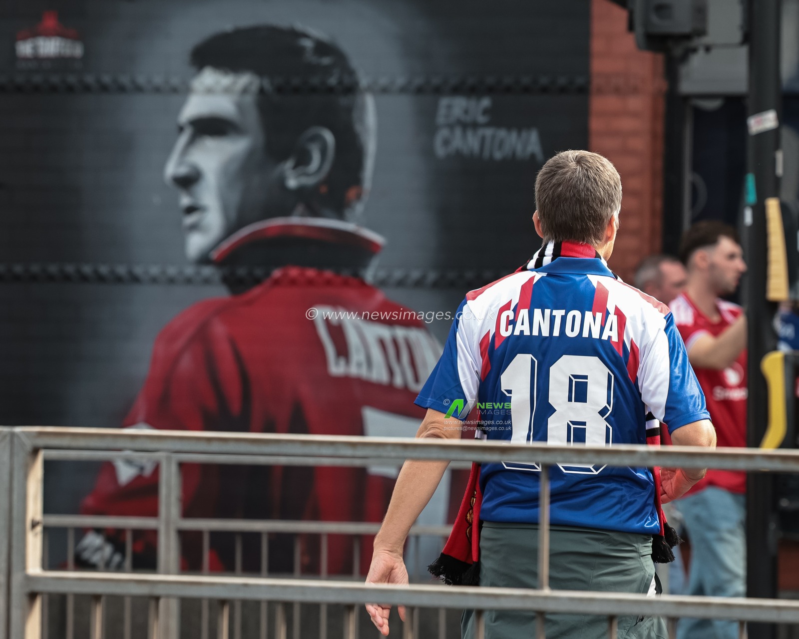 A Manchester United fan with a Cantona 18 shirt on during the Premier League match Manchester United vs Manchester City at Old Trafford, Manchester, United Kingdom on 13 September 2026

(Photo by Mark Cosgrove/News Images)
