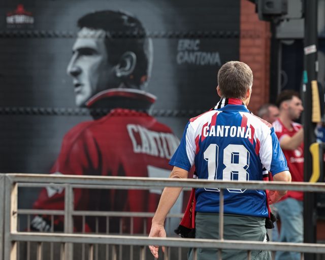 A Manchester United fan with a Cantona 18 shirt on during the Premier League match Manchester United vs Manchester City at Old Trafford, Manchester, United Kingdom on 13 September 2026

(Photo by Mark Cosgrove/News Images)