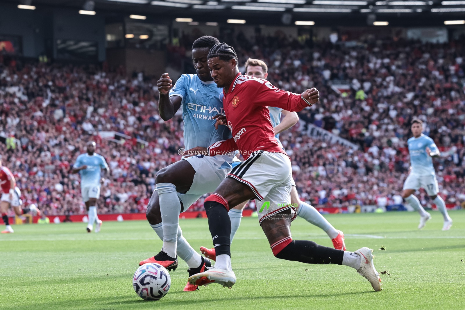 Marcus Rashford of Manchester United is tackled by Marc Guehi of Manchester City during the Premier League match Manchester United vs Manchester City at Old Trafford, Manchester, United Kingdom on 13 September 2026

(Photo by Mark Cosgrove/News Images)