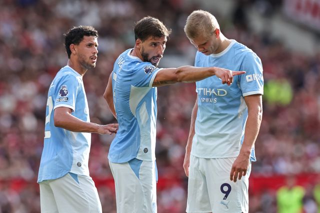 Ruben Dias of Manchester City speaks with Matheus Nunes of Manchester City and Erling Haaland of Manchester City during the Premier League match Manchester United vs Manchester City at Old Trafford, Manchester, United Kingdom on 13 September 2026

(Photo by Mark Cosgrove/News Images)