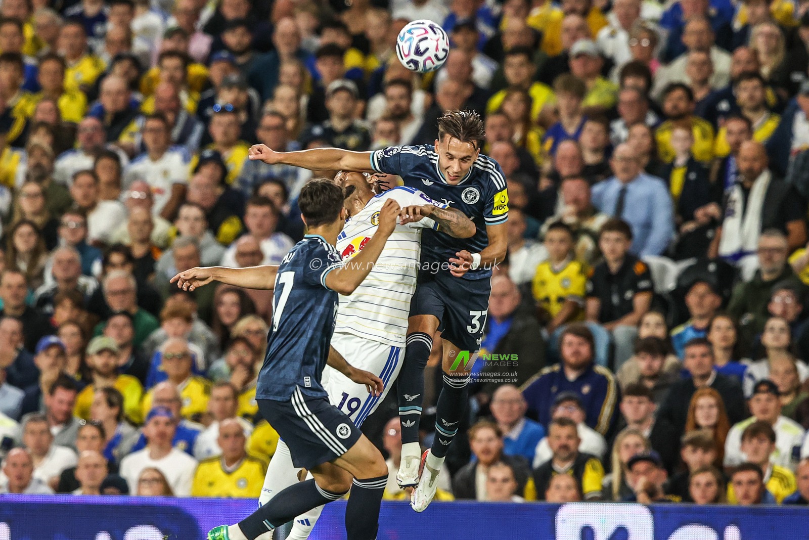 Amar Dedic of Newcastle United jumps up to win the high ball from Noah Okafor of Leeds United during the Premier League match Leeds United vs Newcastle Untied at Elland Road, Leeds, United Kingdom on 14 September 2026

(Photo by Alfie Cosgrove/News Images)