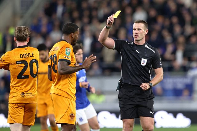 Jackson Tchatchoua of Wolverhampton Wanderers receives a yellow card during the Carabao Cup round 3 match Everton vs Wolverhampton Wanderers at Hill Dickinson Stadium, Liverpool, United Kingdom on 16 September 2026

(Photo by Alfie Cosgrove/News Images)