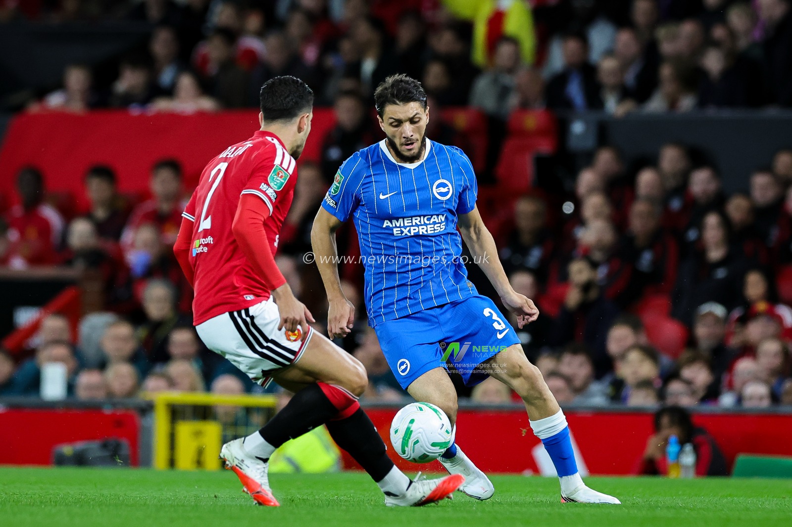 Jaouen Hadjam of Brighton & Hove Albion battles for the ball  with Diogo Dalot of Manchester United during the Carabao Cup round 3 match Manchester United vs Brighton & Hove Albion at Old Trafford, Manchester, United Kingdom on 16 September 2026

(Photo by Mark Cosgrove/News Images)