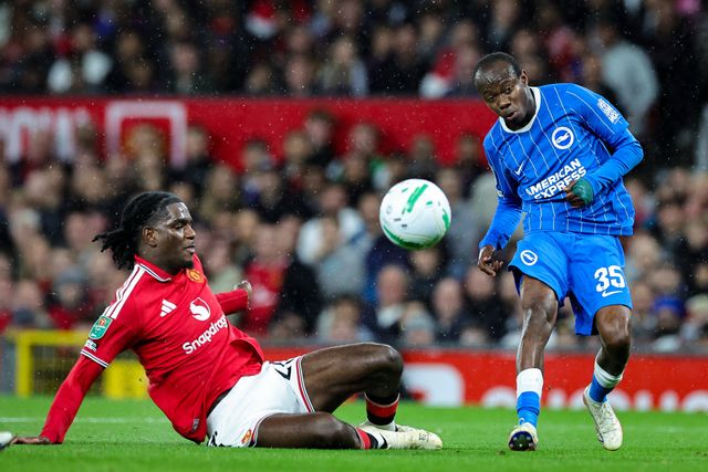 Ayden Heaven of Manchester United slides in to win the ball from Malick Yalcouye of Brighton & Hove Albion during the Carabao Cup round 3 match Manchester United vs Brighton & Hove Albion at Old Trafford, Manchester, United Kingdom on 16 September 2026

(Photo by Mark Cosgrove/News Images)