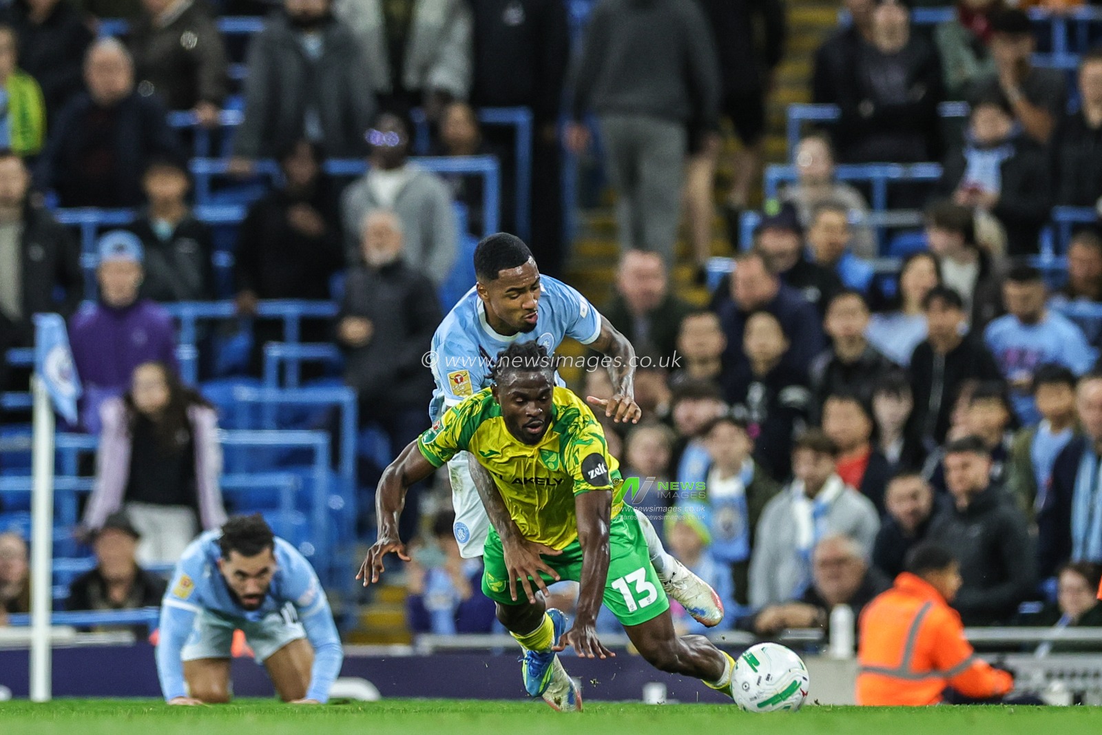 Darlin Yongwa of Norwich City is fouled by Allan of Manchester City during the Carabao Cup round 3 match Manchester City vs Norwich City at Etihad Stadium, Manchester, United Kingdom on 17 September 2026

(Photo by Mark Cosgrove/News Images)