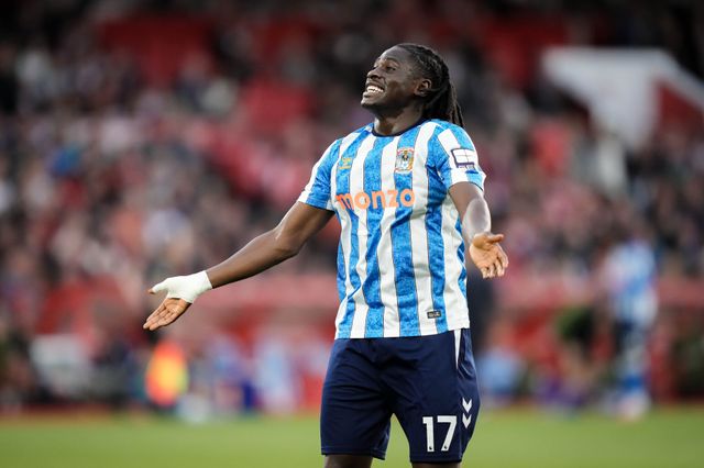 Loum Tchaouna of Coventry City celebrates Jay Dasilva of Coventry City scoring his goal to make it 0-1  during the Premier League match Nottingham Forest vs Coventry City at City Ground, Nottingham, United Kingdom on 19 September 2026

(Photo by Maynard Manyowa/News Images)