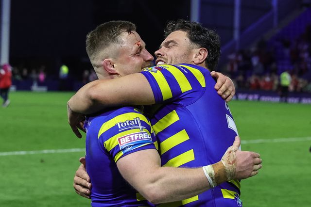 Luke Yates of Warrington Wolves embraces Joe Philbin of Warrington Wolves during the Betfred Super League Play-off Eliminator round match Warrington Wolves vs Hull KR at The Halliwell Jones Stadium, Warrington, United Kingdom on 19 September 2026

(Photo by Mark Cosgrove/News Images)