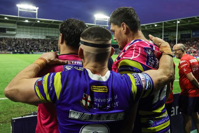 Luke Yates of Warrington Wolves embraces Joe Philbin of Warrington Wolves ad Liam Byrne of Warrington Wolves at the final hooter during the Betfred Super League Play-off Eliminator round match Warrington Wolves vs Hull KR at The Halliwell Jones Stadium, Warrington, United Kingdom on 19 September 2026

(Photo by Mark Cosgrove/News Images)