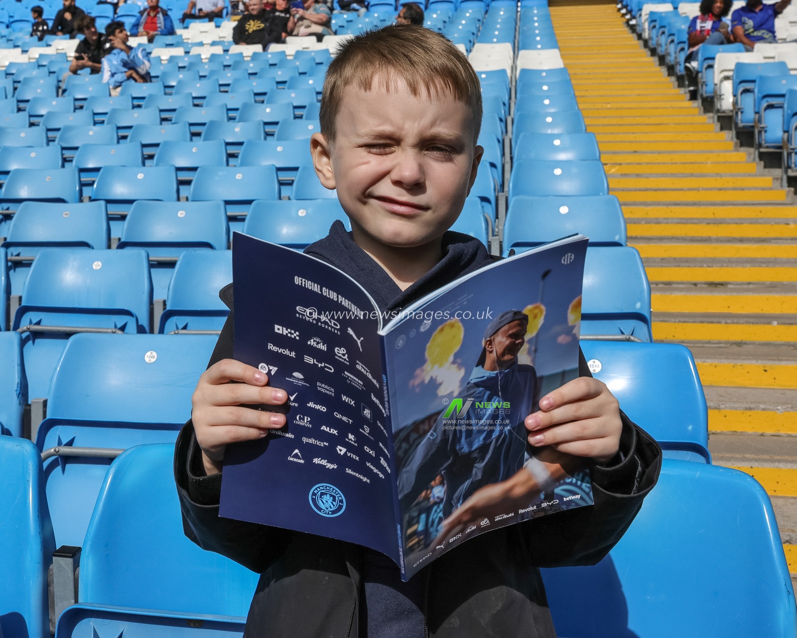A young City fan reading the official match day program with Erling Haaland of Manchester City on the front cover during the Premier League match Manchester City vs Sunderland at Etihad Stadium, Manchester, United Kingdom on 20 September 2026

(Photo by Mark Cosgrove/News Images)