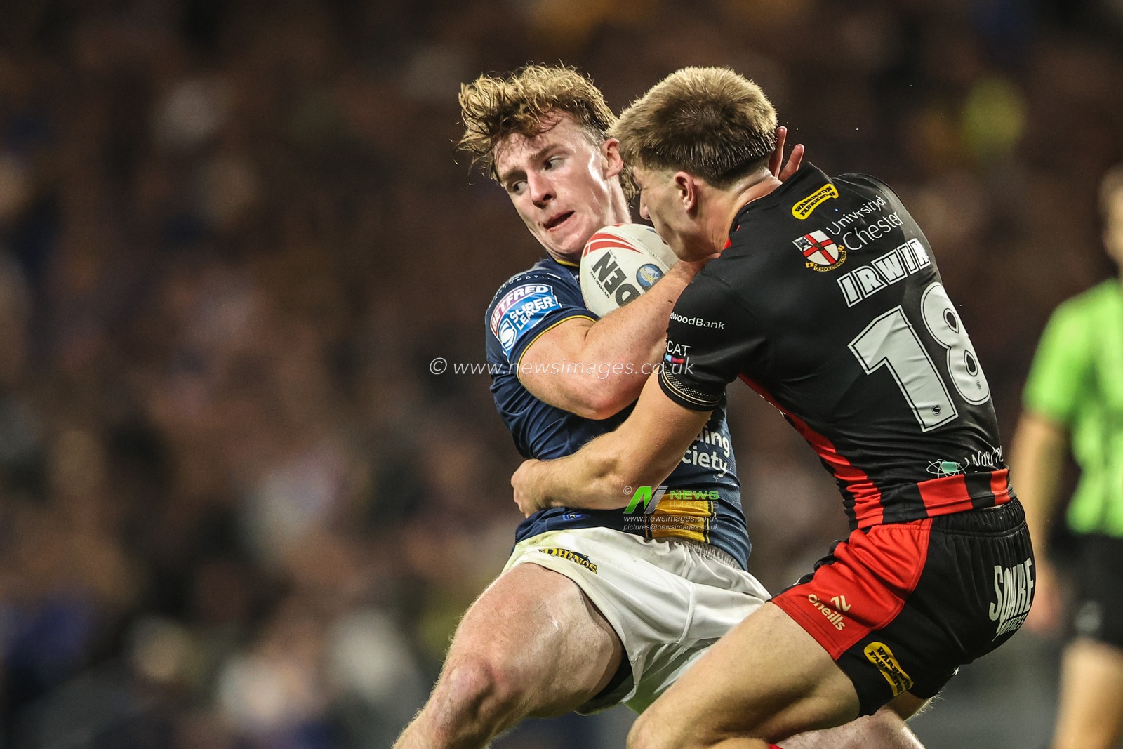 Ned McCormack of Leeds Rhinos is tackled by Ewan Irwin of Warrington Wolves during the Betfred Super League Play-off Semi-Final match Leeds Rhinos vs Warrington Wolves at AMT Headingley Stadium, Leeds, United Kingdom on 25 September 2026

(Photo by Alfie Cosgrove/News Images)