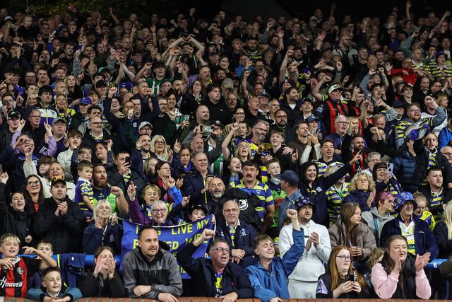 Warrington fans celebrate the win as they book their place in the final at Old Trafford during the Betfred Super League Play-off Semi-Final match Leeds Rhinos vs Warrington Wolves at AMT Headingley Stadium, Leeds, United Kingdom on 25 September 2026

(Photo by Mark Cosgrove/News Images)